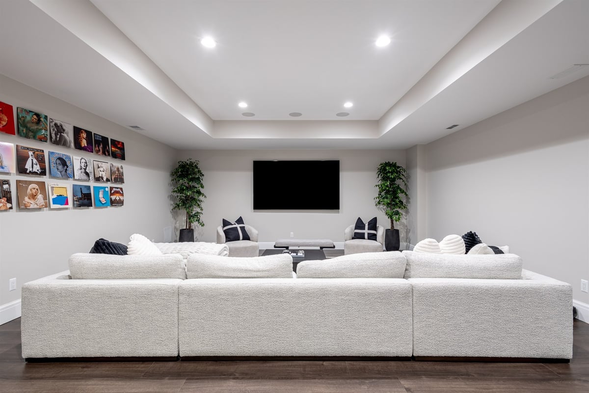 basement-rec-room-with-a-large-white-sectional-and-tv-southeast-mi-optimized