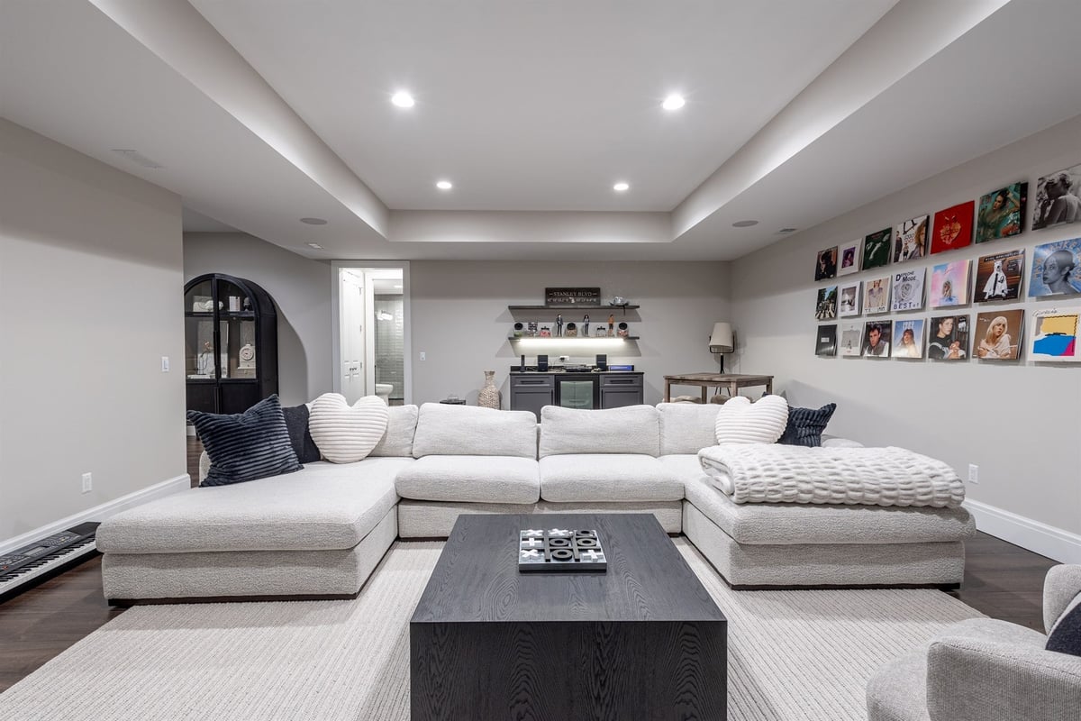 basement-rec-room-with-a-sectional-wet-bar-and-gallery-wall-southeast-mi-optimized