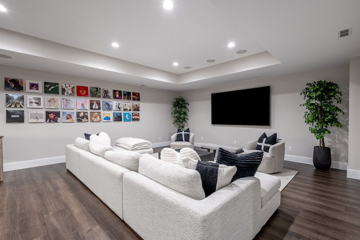 basement-rec-room-with-a-white-sectional-and-a-gallery-wall-southeast-mi-optimized