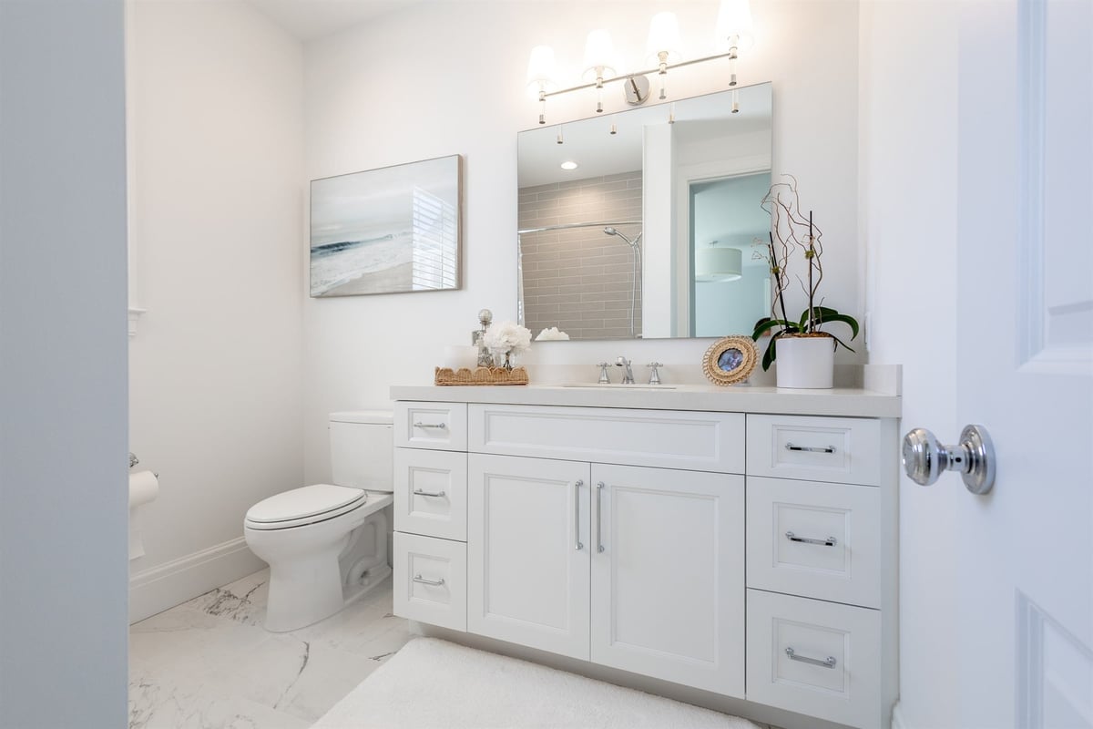 bathroom-with-a-white-vanity-quartz-top-and-framed-mirror-southeast-mi-optimized