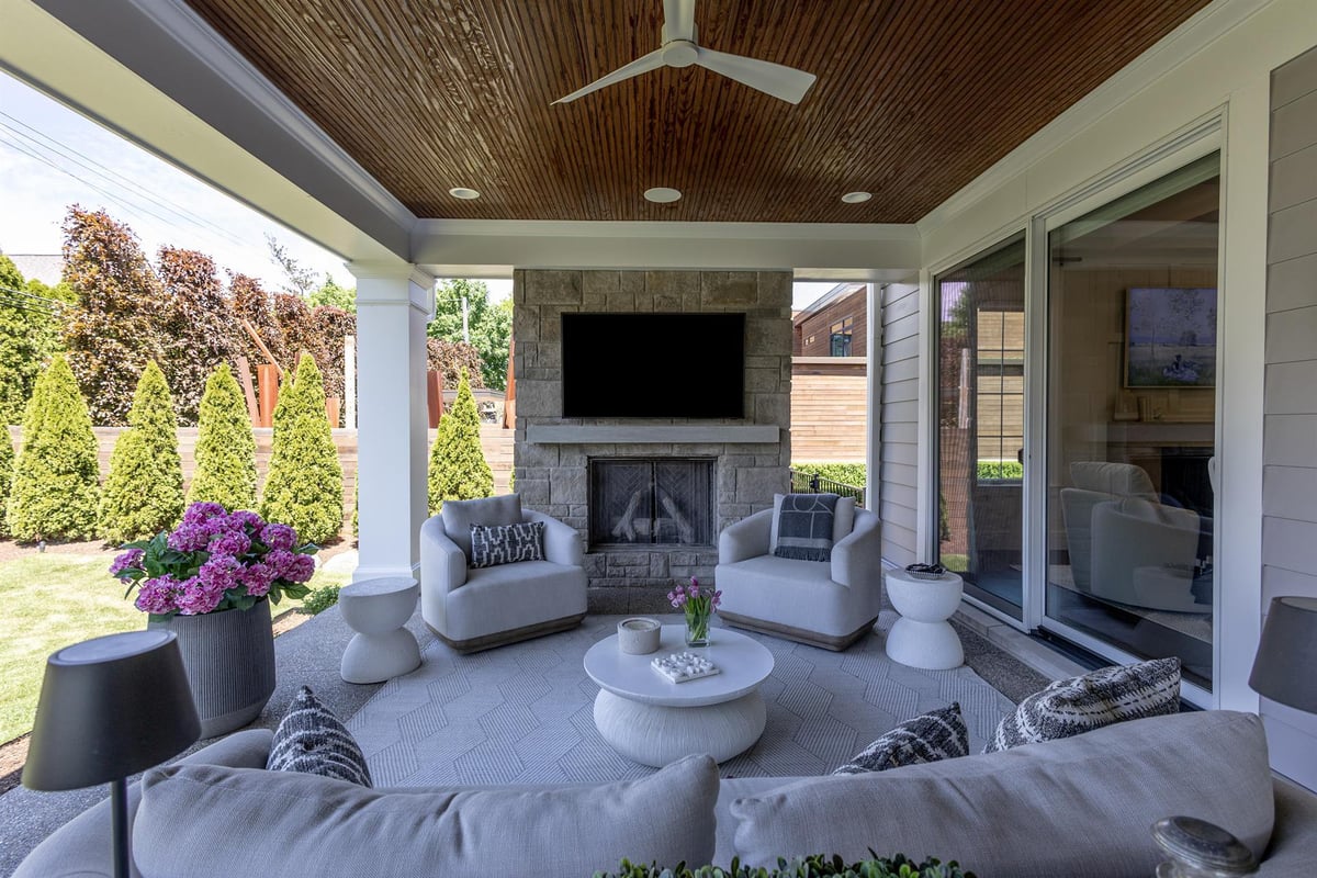 covered-patio-with-a-stone-fireplace-tv-and-outdoor-sectional-southeast-mi-optimized