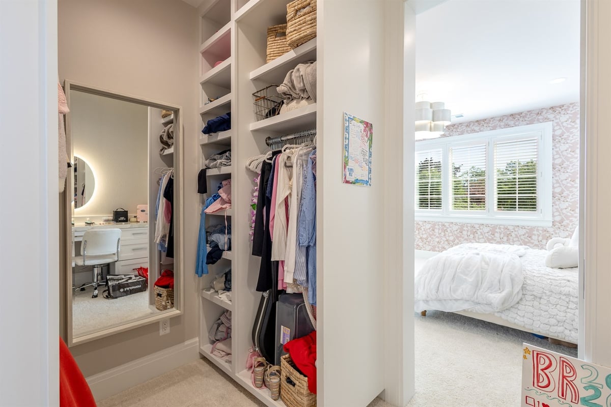 custom-walk-in-closet-with-built-in-shelving-and-a-vanity-area-southeast-mi-optimized