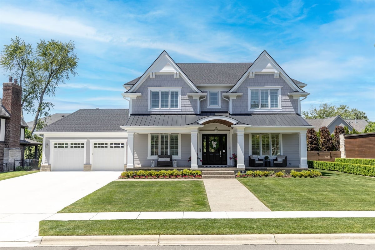 front-elevation-of-a-gray-custom-home-with-a-covered-porch-and-garage-southeast-mi-optimized