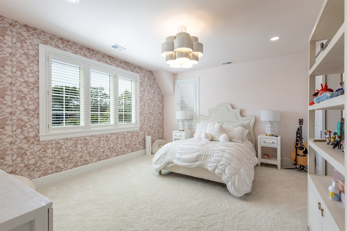 girl-s-bedroom-with-pink-floral-wallpaper-and-built-in-shelving-southeast-mi-optimized