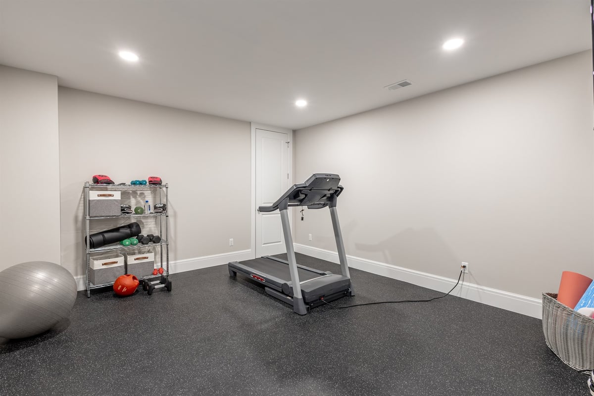 home-gym-with-a-treadmill-exercise-ball-and-rubber-flooring-southeast-mi-optimized