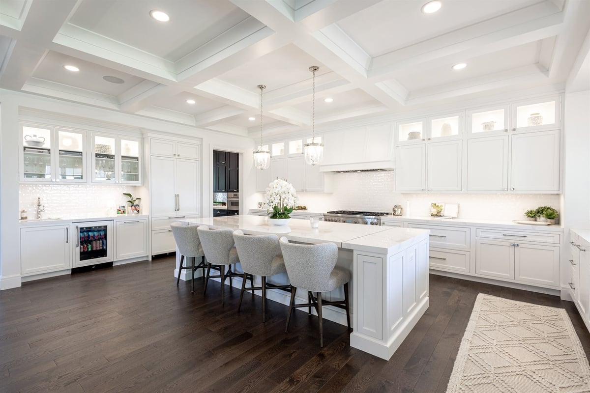 main-kitchen-with-a-white-island-coffered-ceiling-and-beverage-fridge-southeast-mi-optimized