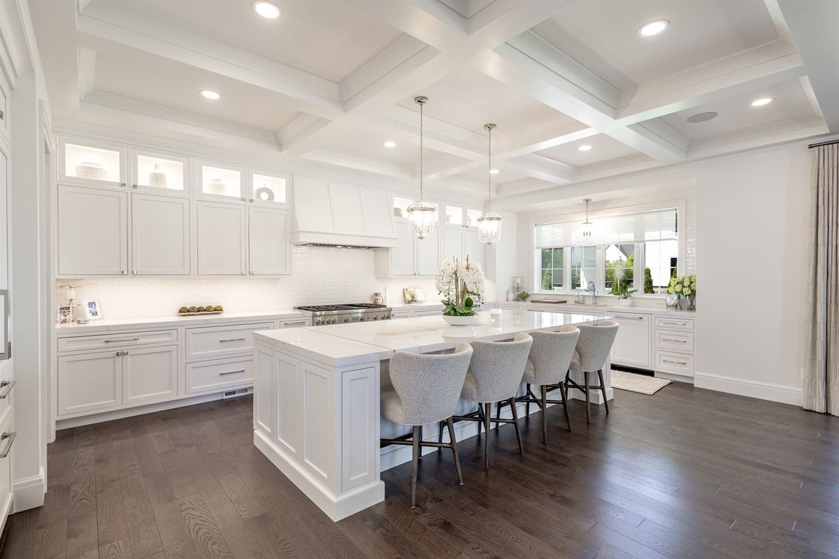 main-kitchen-with-white-cabinets-a-coffered-ceiling-and-a-large-island-southeast-mi-optimized
