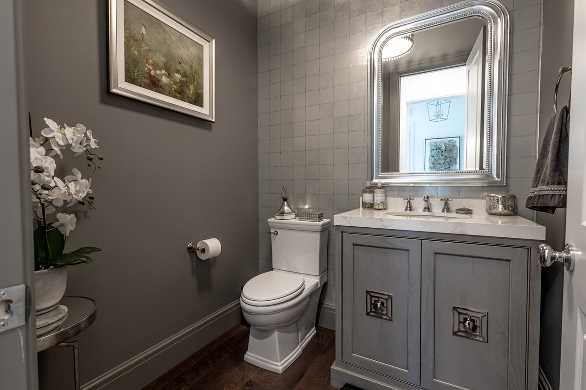 powder-room-with-a-gray-vanity-marble-top-and-dark-tiled-walls-southeast-mi-optimized