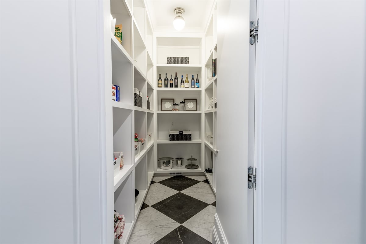 walk-in-pantry-with-white-shelving-and-a-checkered-marble-floor-southeast-mi-optimized