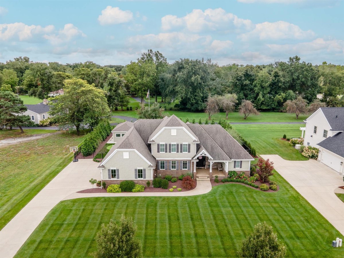 aerial-front-of-the-custom-home-with-driveway-and-landscaping-southeast-mi-optimized