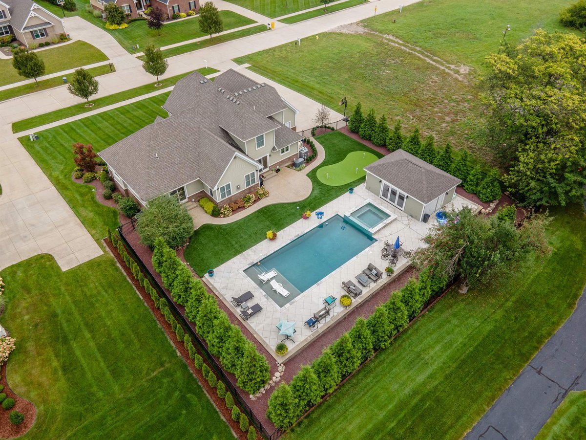aerial-rear-with-the-pool-spa-patio-putting-green-and-pool-house-southeast-mi-optimized
