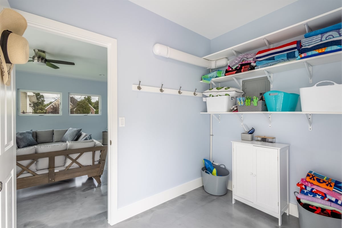 pool-house-changing-room-with-shelving-open-to-the-lounge-southeast-mi-optimized