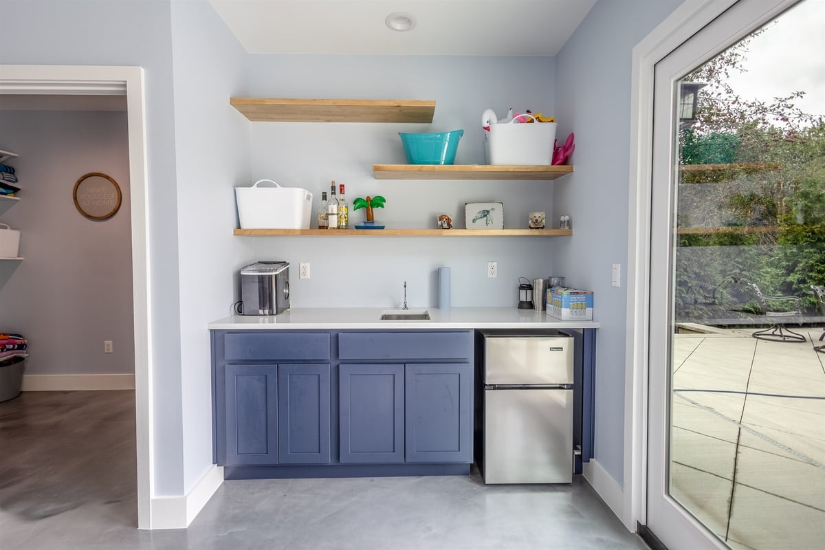 pool-house-wet-bar-with-blue-cabinets-a-sink-and-a-mini-fridge-southeast-mi-optimized