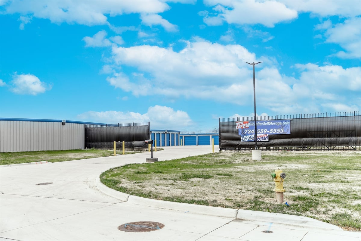 facility-drive-with-a-security-gate-and-metal-buildings-commercial-self-storage-southeast-mi-optimized