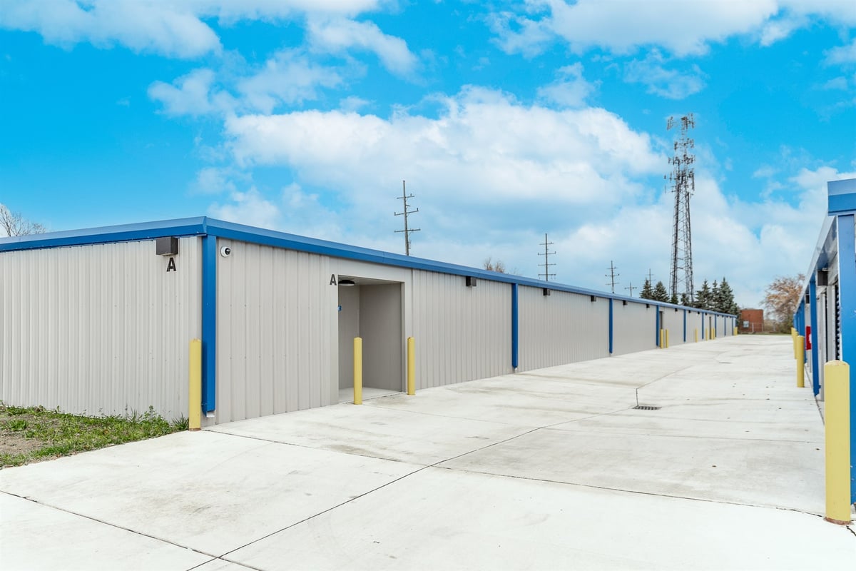 long-exterior-view-of-the-buildings-with-an-open-unit-and-drive-lane-commercial-self-storage-southeast-mi-optimized