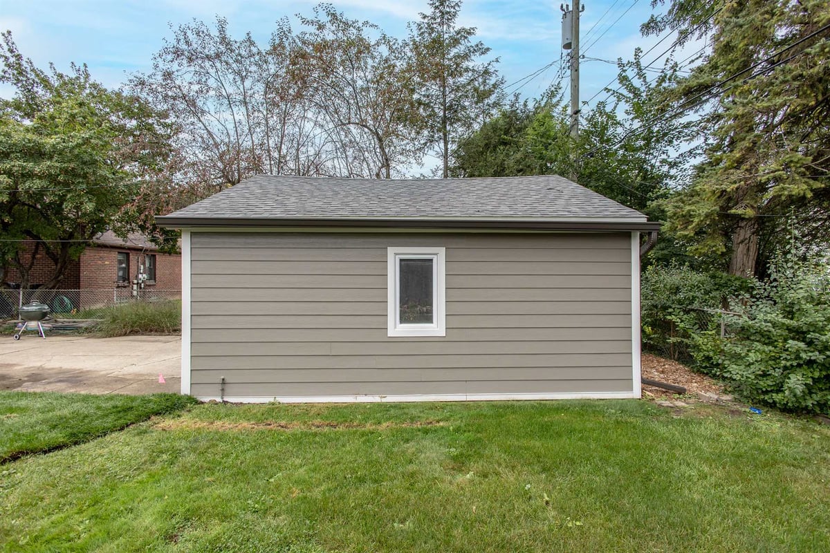 detached-garage-with-gray-siding-and-a-hip-roof-southeast-mi-optimized