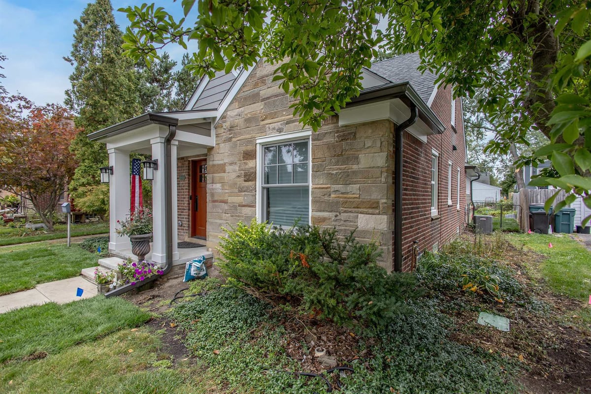 front-corner-with-stone-brick-and-a-columned-covered-porch-southeast-mi-optimized