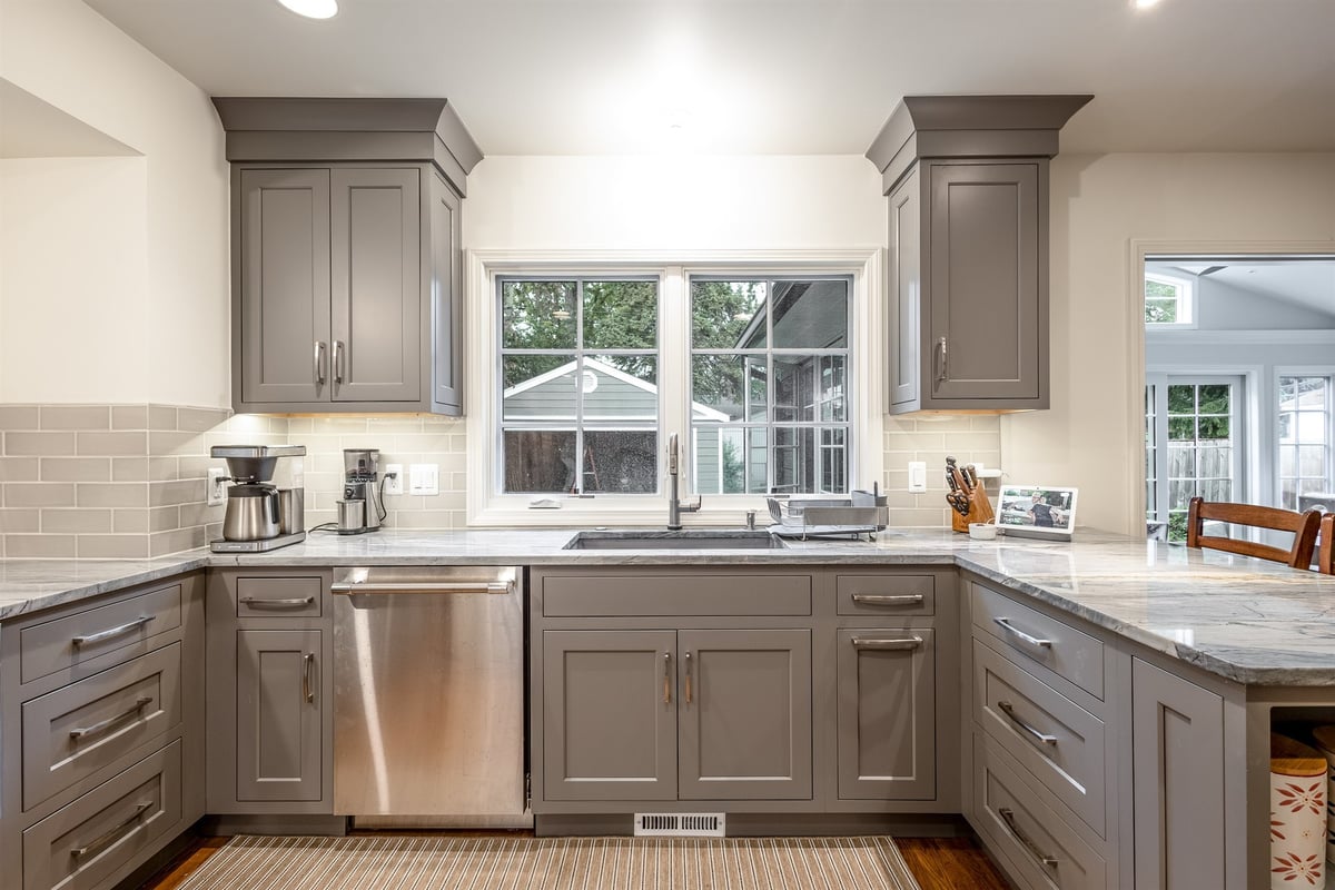 kitchen-with-gray-cabinets-a-window-over-the-sink-and-quartz-counters-southeast-mi-optimized