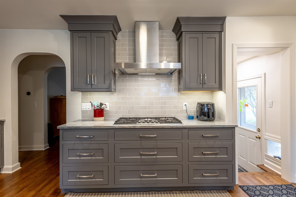 kitchen-with-gray-shaker-cabinets-a-stainless-hood-and-subway-backsplash-southeast-mi-optimized