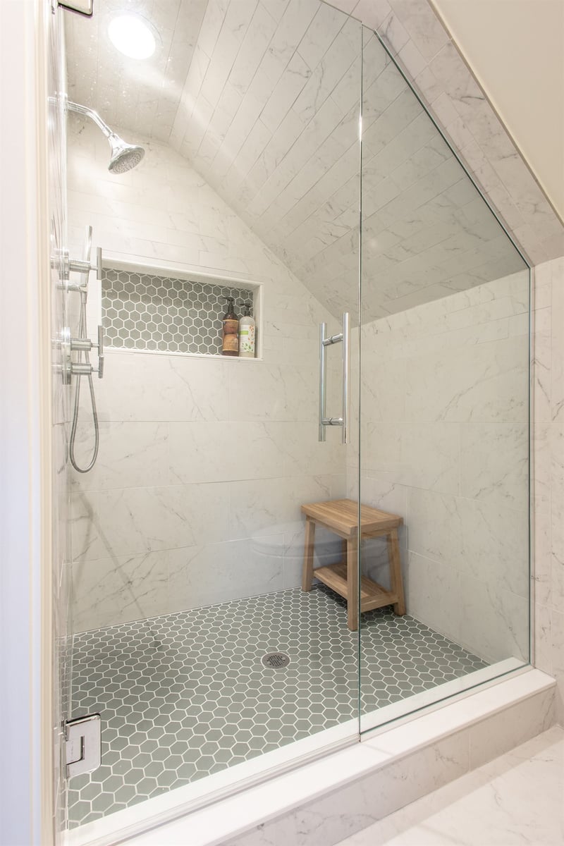 marble-tiled-walk-in-shower-with-a-sloped-ceiling-and-niche-southeast-mi-optimized