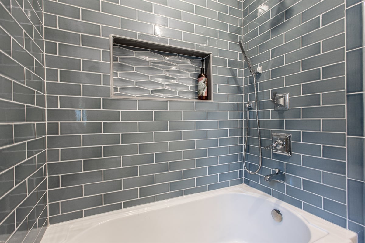 tub-shower-with-blue-subway-tile-and-a-recessed-niche-southeast-mi-optimized