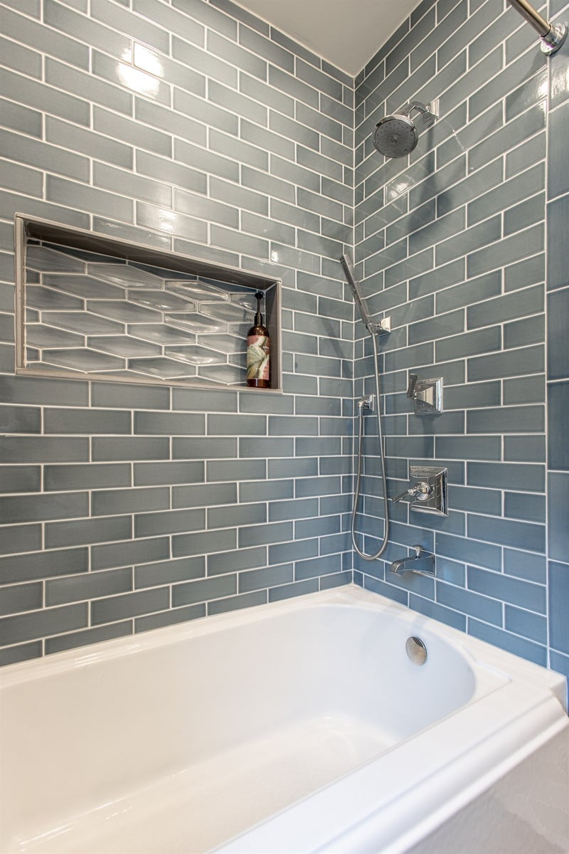 tub-shower-with-blue-subway-tile-niche-and-rain-and-handheld-heads-southeast-mi-optimized
