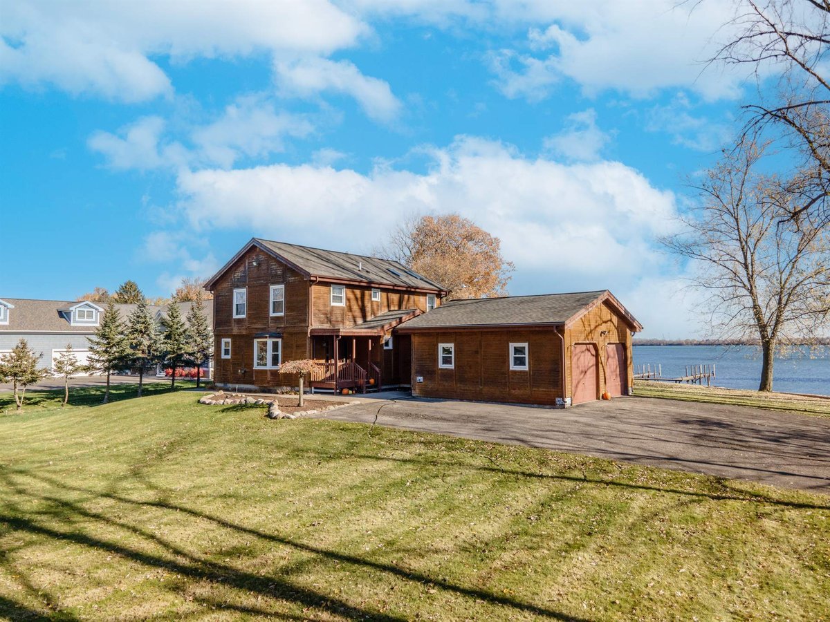 brown-wood-home-and-detached-garage-before-renovation-waterfront-grosse-ile-mi-optimized