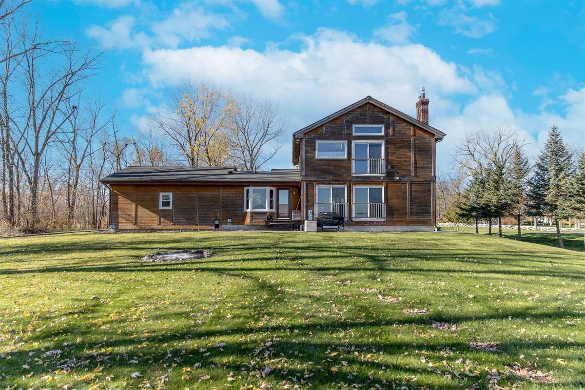 brown-wood-home-before-renovation-front-with-a-low-wing-grosse-ile-mi-optimized