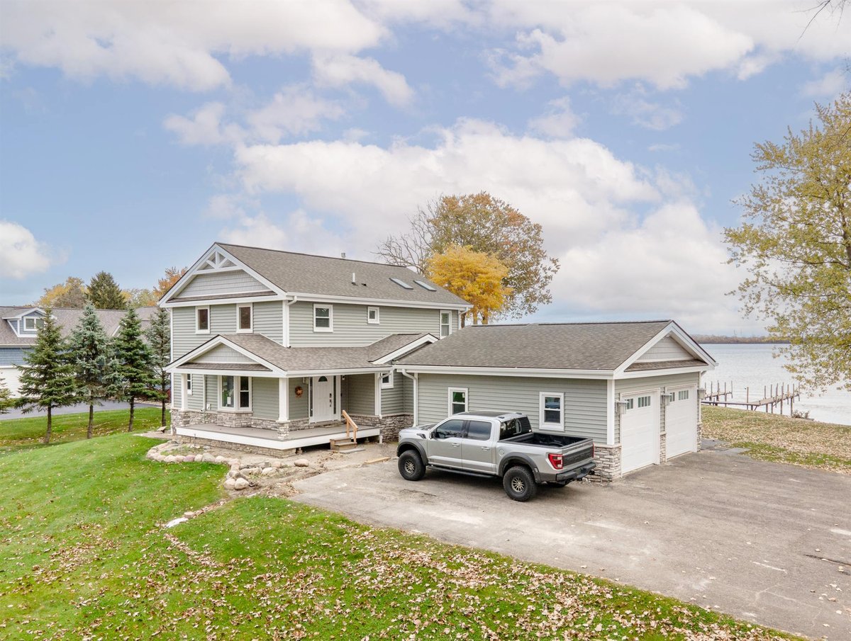 gray-home-after-renovation-front-and-side-with-an-attached-garage-grosse-ile-mi-optimized