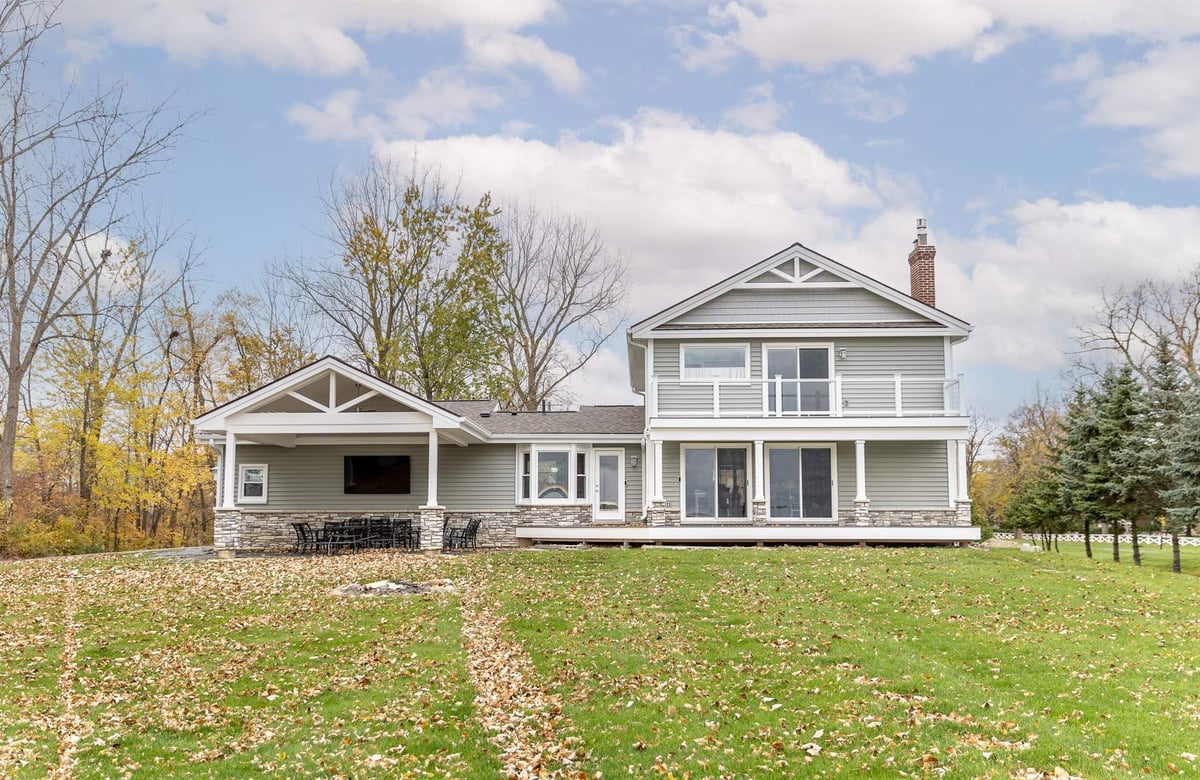 renovated-home-rear-with-a-covered-porch-and-stone-columns-grosse-ile-mi-1-optimized