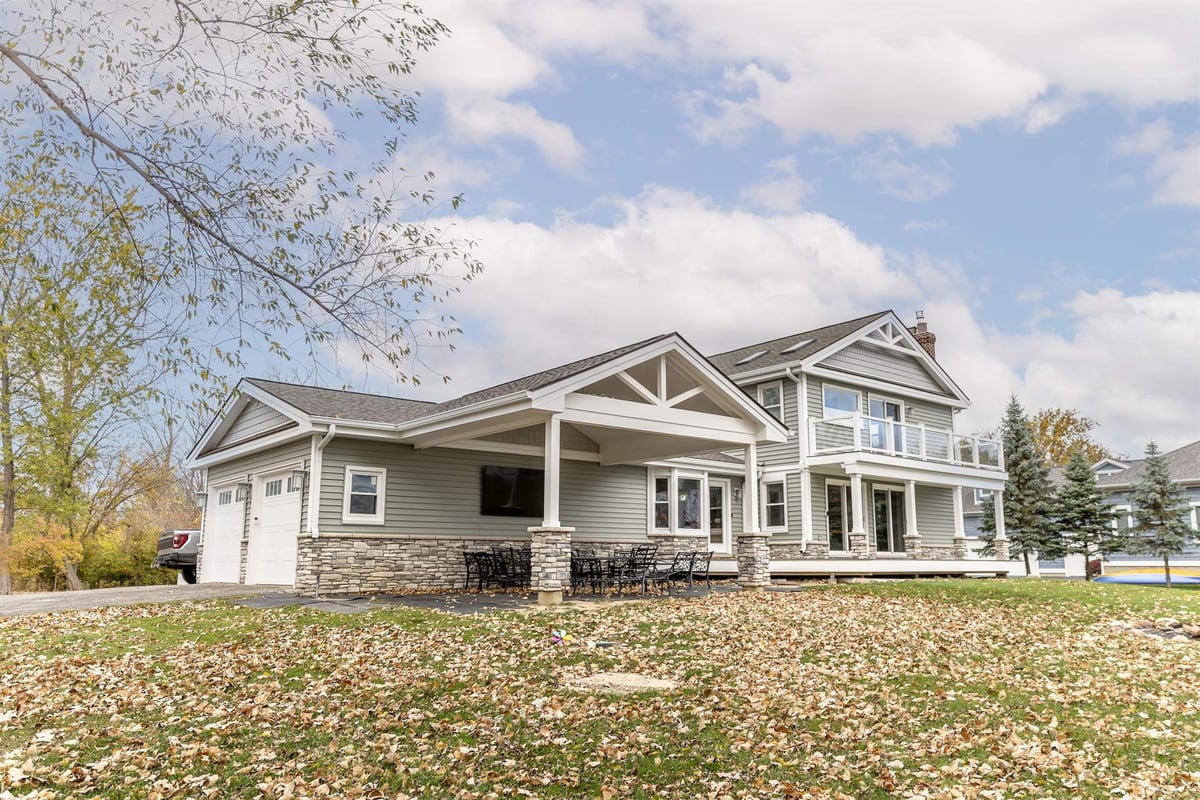 renovated-home-with-attached-garage-side-view-with-a-covered-porch-grosse-ile-mi-optimized