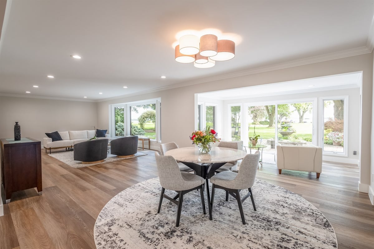 dining-area-with-a-round-table-drum-chandelier-and-sliding-patio-doors-southeast-mi-optimized