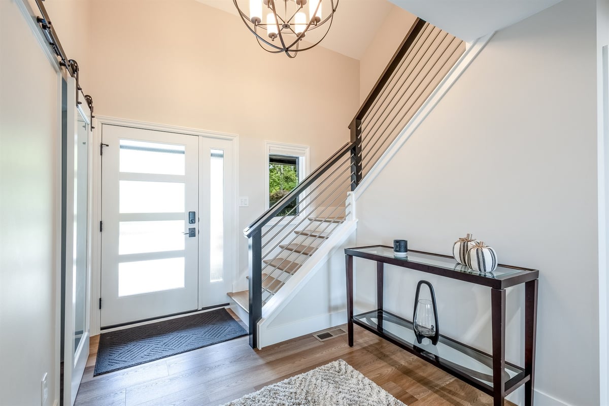 entry-foyer-with-a-barn-door-floating-stairs-and-a-cable-railing-southeast-mi-optimized