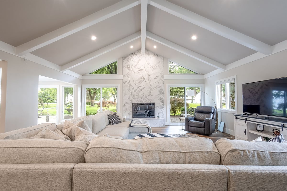 great-room-with-a-vaulted-beamed-ceiling-and-a-marble-fireplace-southeast-mi-optimized