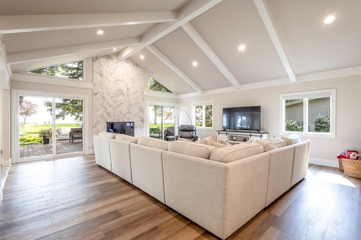 great-room-with-a-vaulted-beamed-ceiling-and-sliding-doors-to-the-patio-southeast-mi-optimized