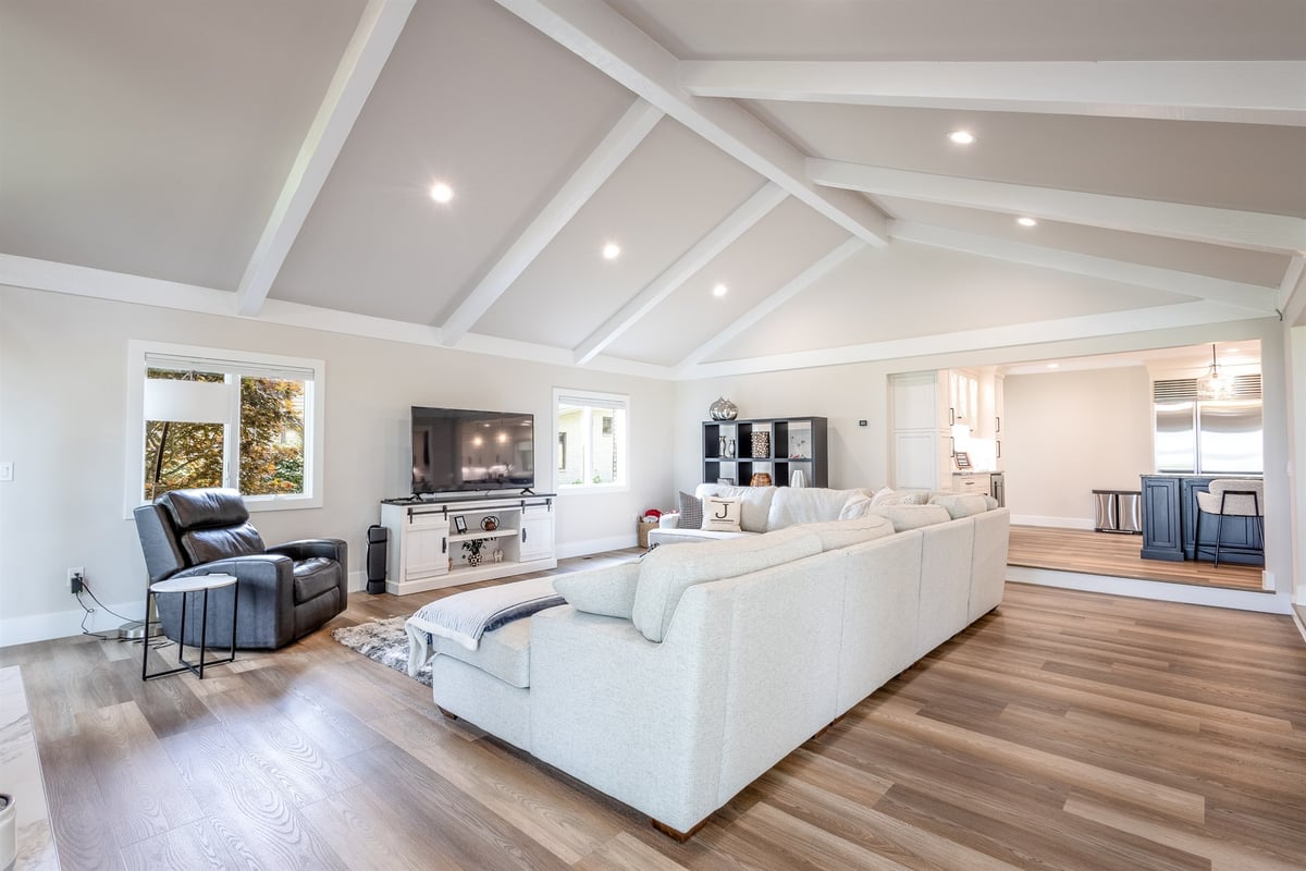 great-room-with-a-vaulted-beamed-ceiling-open-to-the-kitchen-southeast-mi-optimized