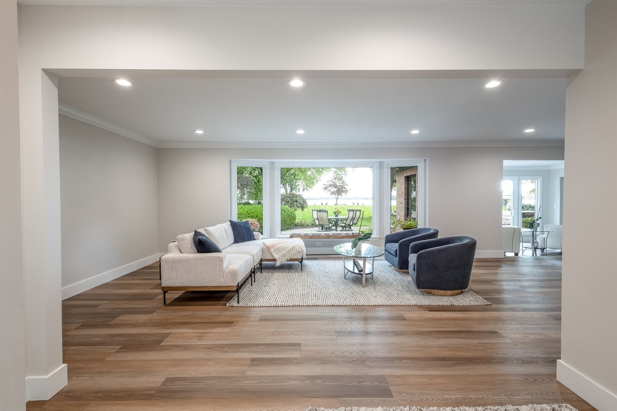 living-room-with-a-wall-of-windows-and-open-concept-flooring-southeast-mi-optimized