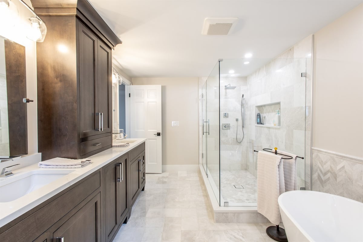 master-bath-with-a-dark-double-vanity-marble-shower-and-freestanding-tub-southeast-mi-optimized