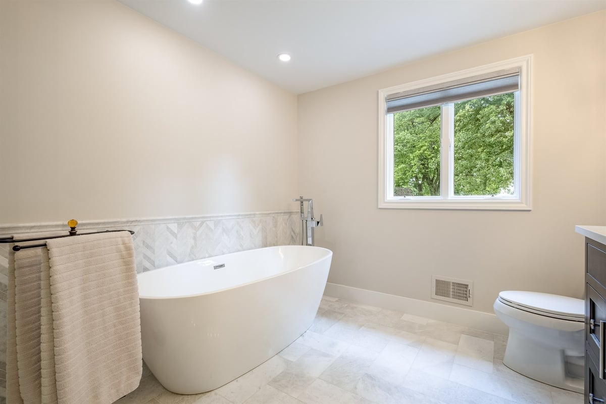 master-bath-with-a-freestanding-soaking-tub-and-a-marble-chevron-accent-southeast-mi-optimized