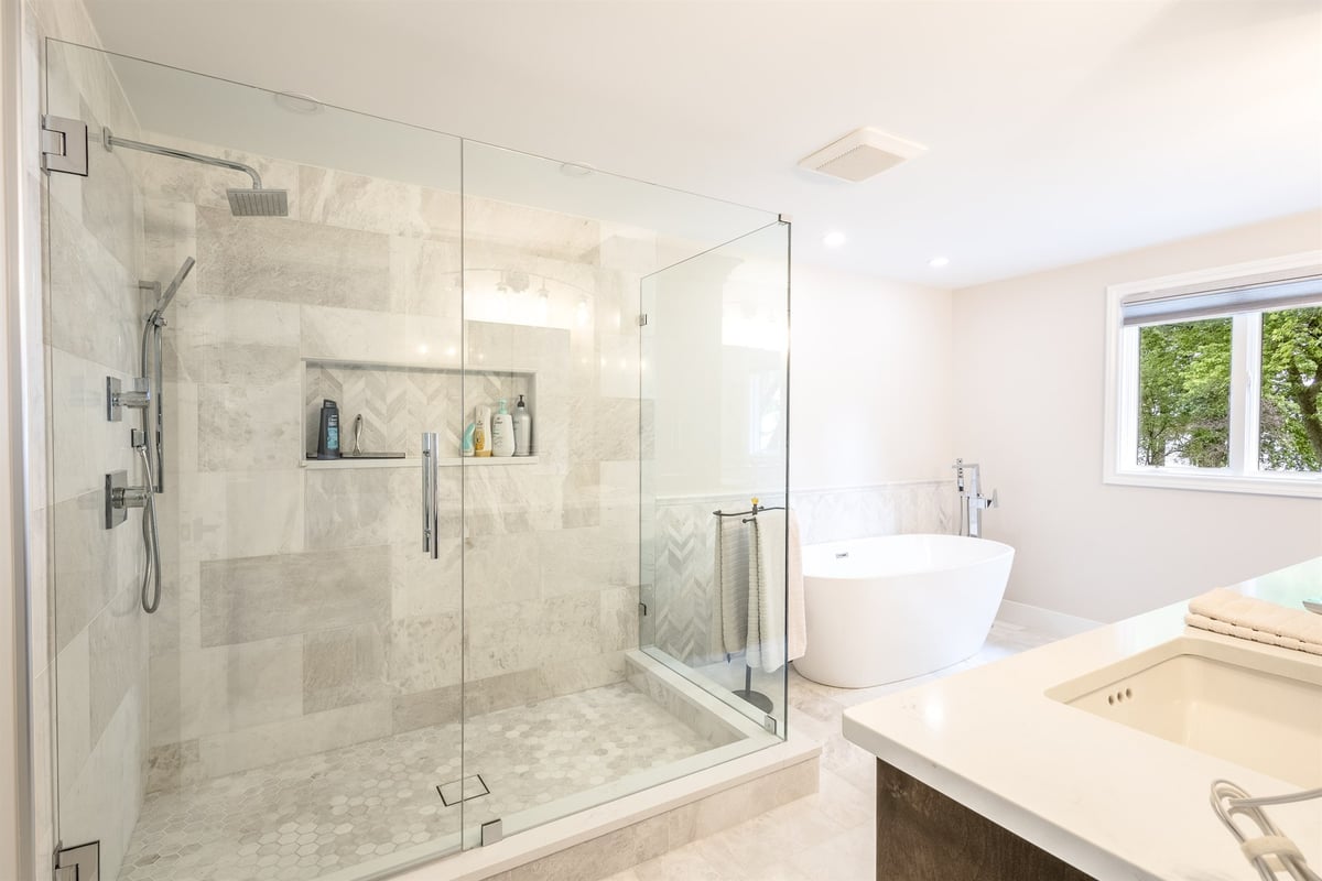 master-bath-with-a-large-marble-walk-in-shower-and-a-freestanding-tub-southeast-mi-optimized