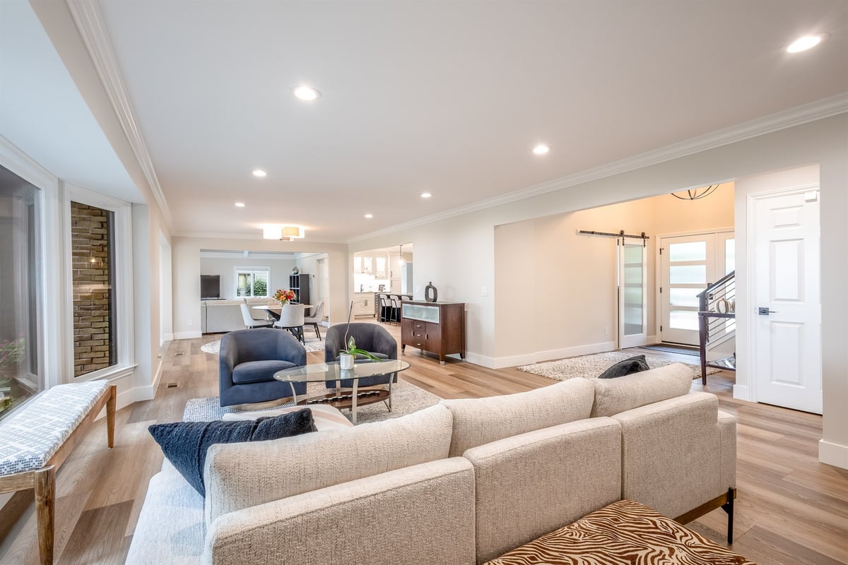 open-living-room-with-a-sectional-and-a-barn-door-to-the-entry-southeast-mi-optimized