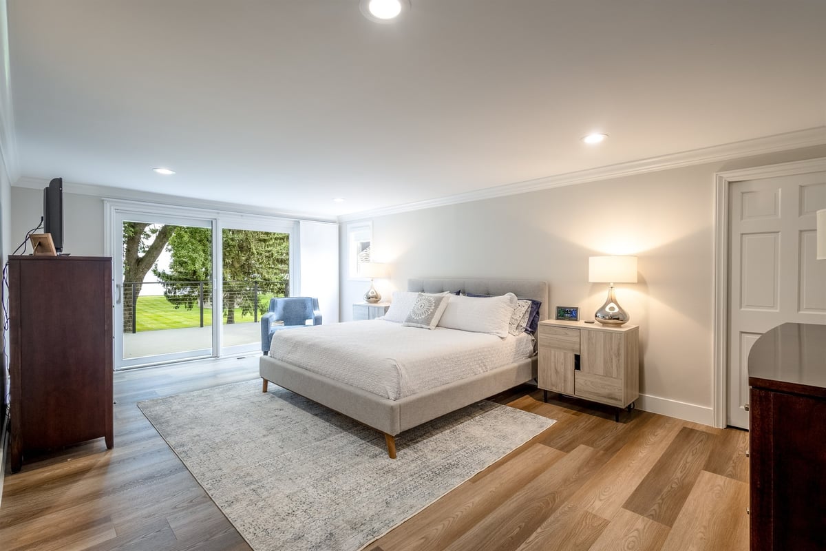primary-bedroom-with-sliding-doors-to-the-yard-and-dual-nightstands-southeast-mi-optimized