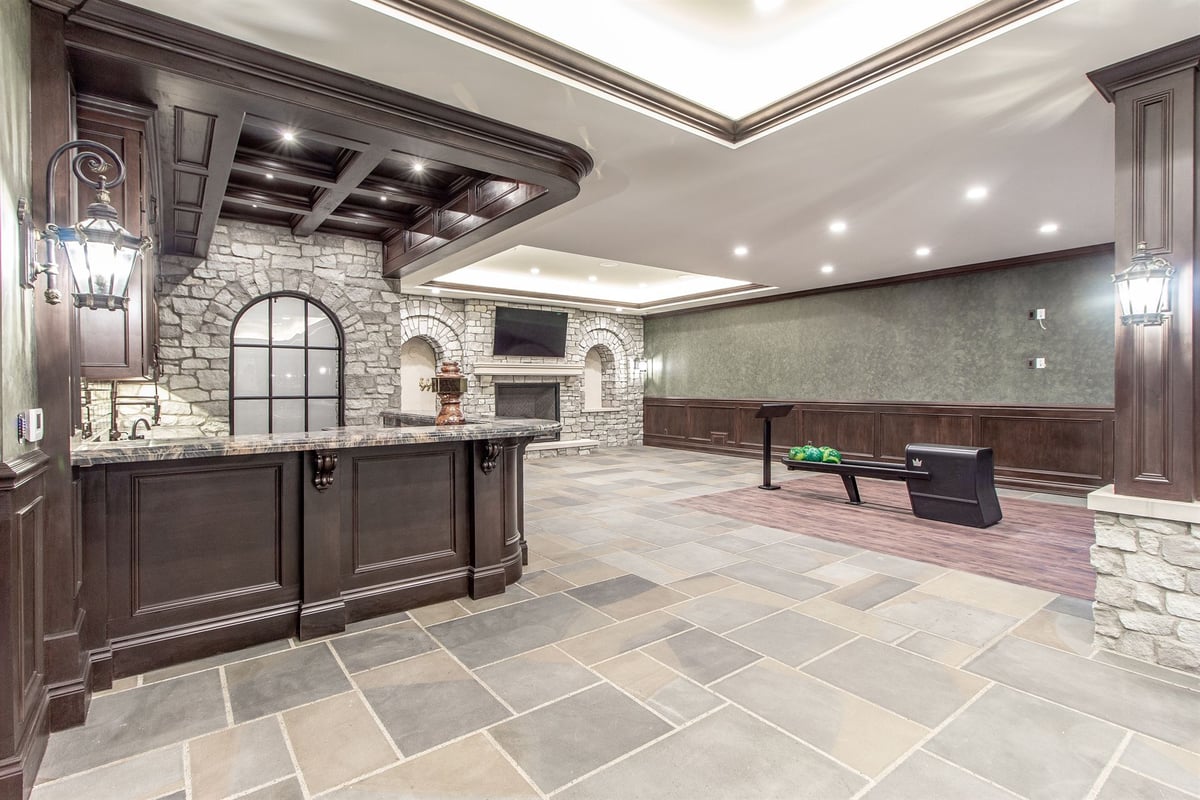 basement-bar-and-game-area-with-stone-arches-and-slate-floors-southeast-mi-optimized
