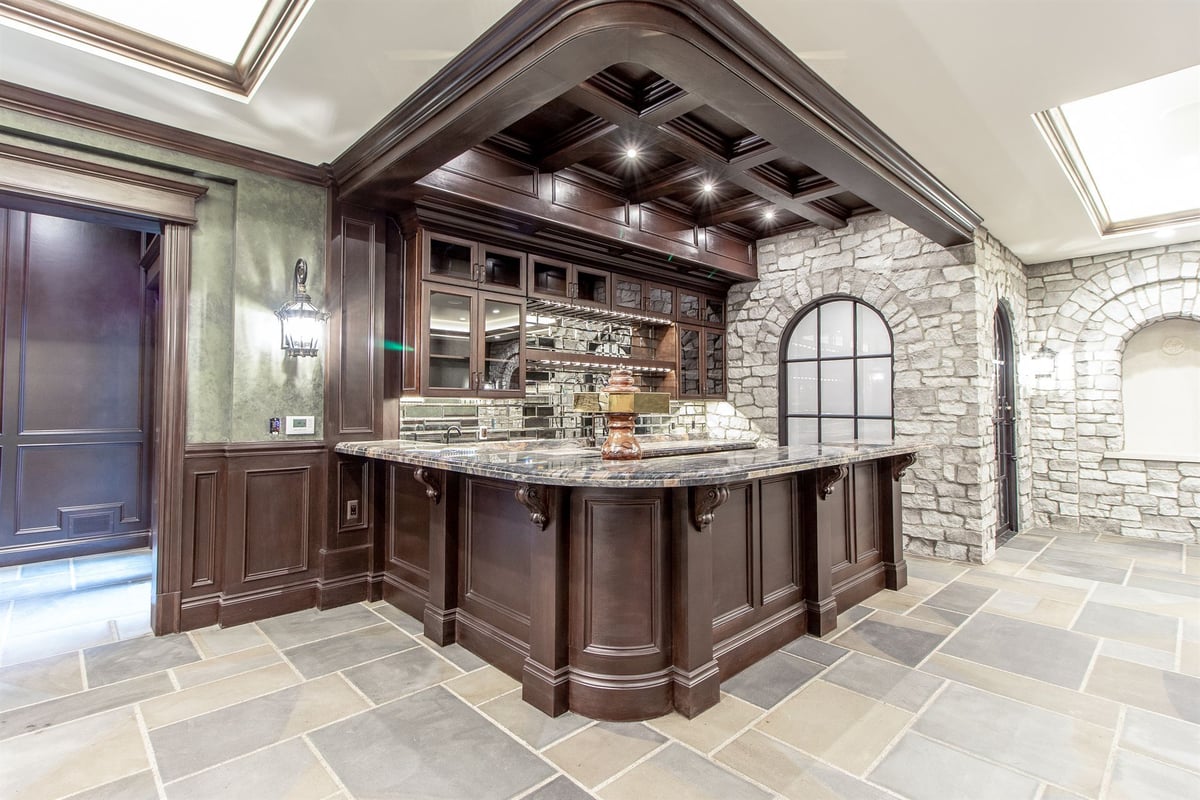 basement-bar-with-a-granite-top-coffered-wood-ceiling-and-stone-arches-southeast-mi-optimized