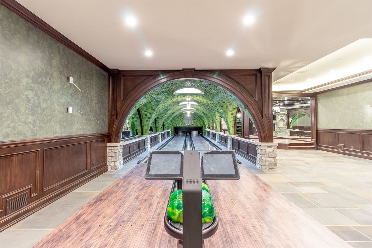 bowling-alley-framed-by-a-dark-wood-arch-with-green-vaulted-lanes-southeast-mi-optimized
