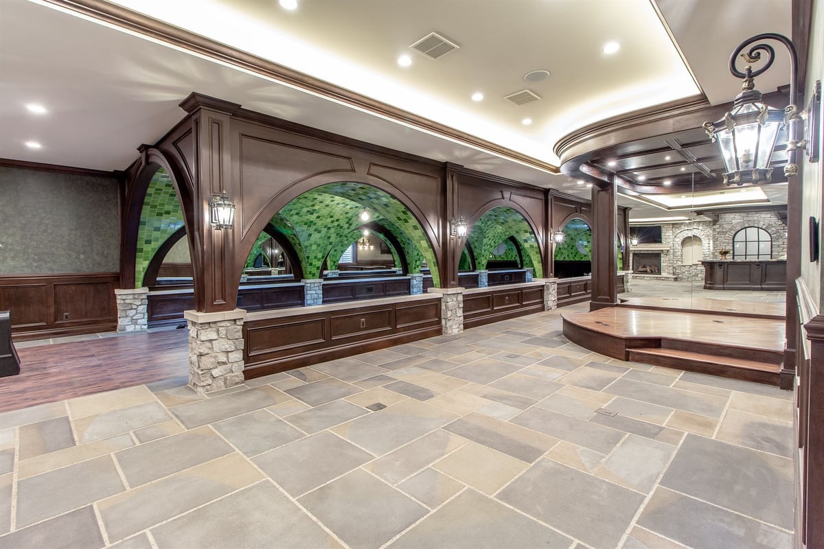 rec-area-with-stone-arches-a-bar-and-a-raised-platform-southeast-mi-optimized