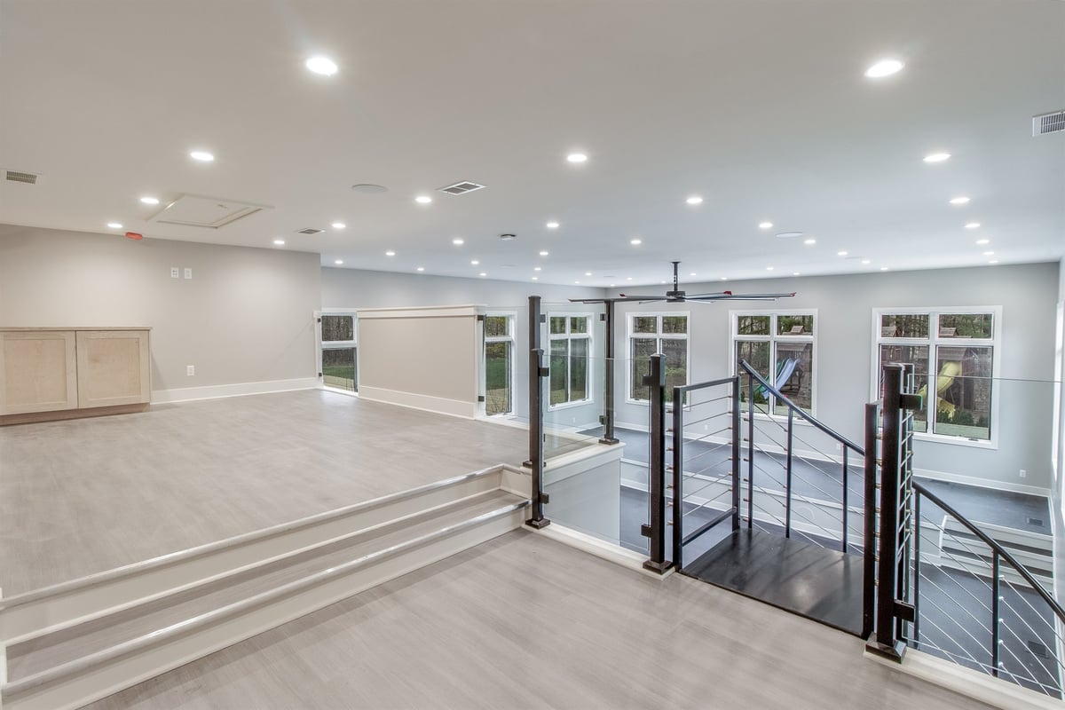 upper-loft-overlooking-the-lower-level-with-a-glass-and-cable-railing-southeast-mi-optimized