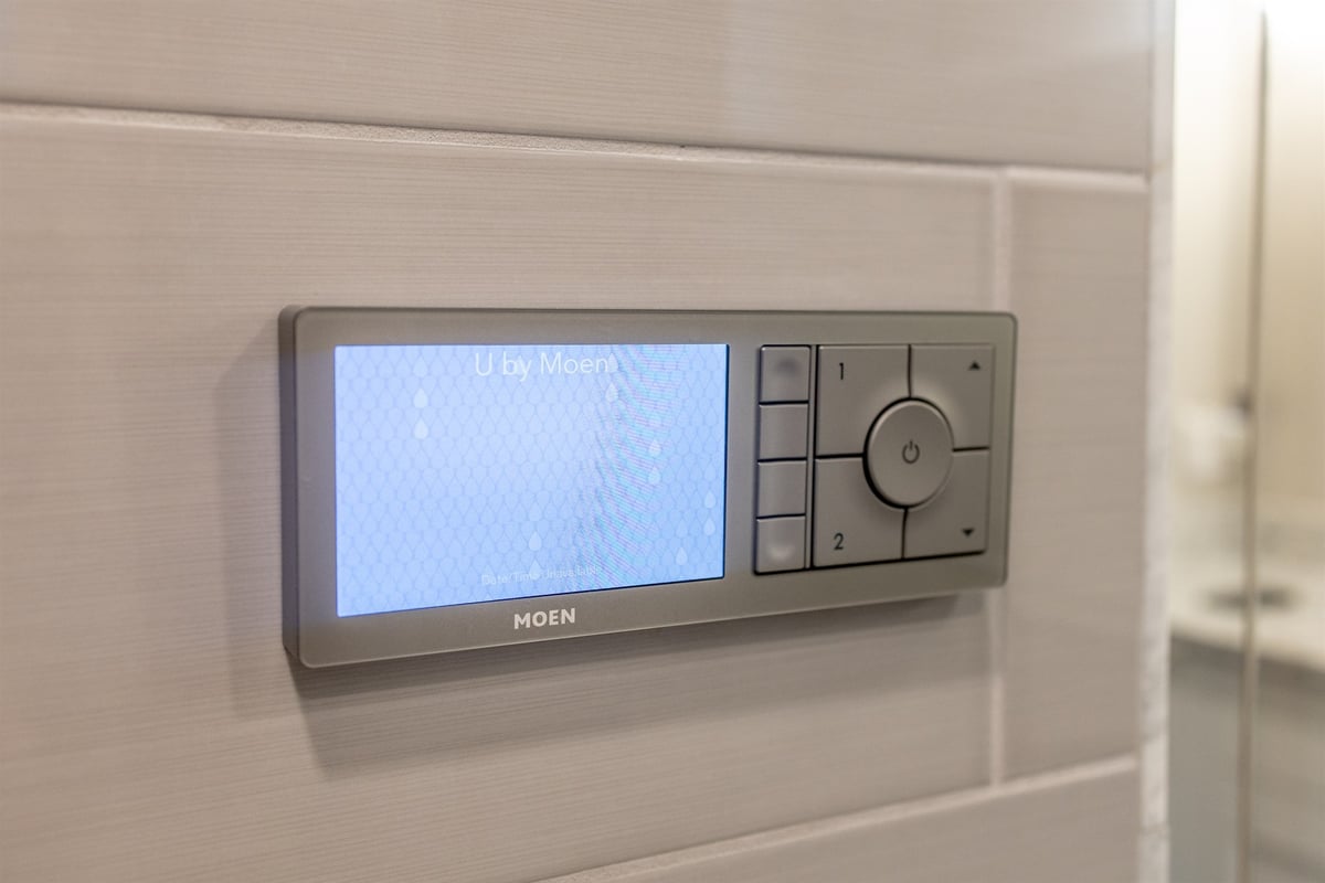close-up-of-a-moen-digital-shower-controller-on-a-tiled-shower-wall-southeast-mi-optimized