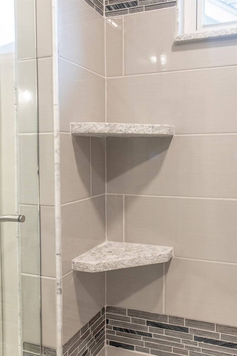 corner-shower-shelves-in-quartz-set-into-gray-tile-southeast-mi-optimized