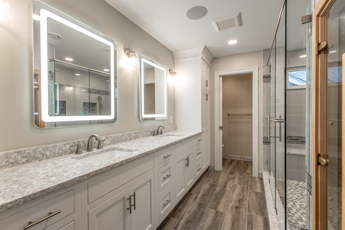 remodeled-master-bathroom-with-a-double-quartz-vanity-and-backlit-led-mirrors-southeast-mi-optimized